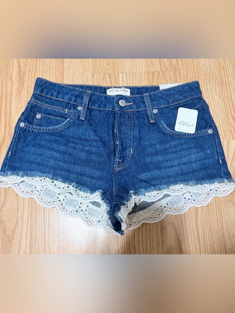 🔥🔥🔥BUY NWT
We The Free Indigo Denim Shorts with White Eyelet Lace Trim